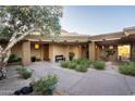 Secluded courtyard with desert landscaping and ample seating at 9216 E Sky Line Dr, Scottsdale, AZ 85262