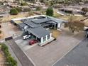Aerial view of a modern home featuring a metal roof, gravel landscaping, and ample parking at 23325 S 132Nd St, Chandler, AZ 85249