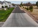 Long driveway leading up to a beautiful home in a rural location with mature trees and landscaping at 23325 S 132Nd St, Chandler, AZ 85249