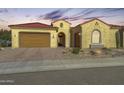 Single-story home with terracotta tile roof, neutral exterior, and landscaped front yard at 27552 W Tonopah Dr, Buckeye, AZ 85396