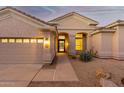 Home exterior showcasing a welcoming entryway and two-car garage at 11568 E Whispering Wind Dr, Scottsdale, AZ 85255