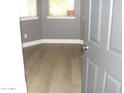 Comfortable bedroom featuring new wood floors, natural light, and neutral paint at 4512 W Stoneman Dr, Anthem, AZ 85086
