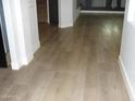 Bright living room features new wood floors and neutral paint at 4512 W Stoneman Dr, Anthem, AZ 85086