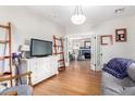 Spacious living area with hardwood floors leading to a cozy seating area at 38 W Lynwood St, Phoenix, AZ 85003