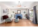 Bright living room featuring hardwood floors and a decorative fireplace at 38 W Lynwood St, Phoenix, AZ 85003