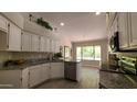 Renovated kitchen, featuring granite countertops and stainless steel appliances at 5452 S Pyrite Cir, Gold Canyon, AZ 85118