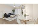 Bright living space showcasing modern decor, a decorative mirror, and adjacent dining area at 10401 N Saguaro Blvd # 224, Fountain Hills, AZ 85268