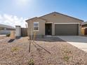 Single-story house showcasing desert landscaping and a neutral color palette at 3451 E Alexander Dr, San Tan Valley, AZ 85143