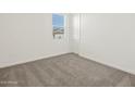 Simple bedroom with neutral carpeting at 36973 W La Paz St, Maricopa, AZ 85138