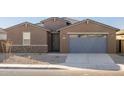 Single-story home with a two-car garage at 36973 W La Paz St, Maricopa, AZ 85138