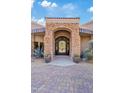 Ornate iron front door entrance to a beautiful home at 10801 E Happy Valley Rd # 27, Scottsdale, AZ 85255