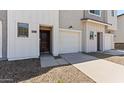 Stylish townhome with a single-car garage, neutral tones, and modern curb appeal at 7449 S 75Th Dr, Laveen, AZ 85339