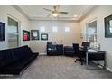 Home office with a desk, computer and comfortable sofa at 7325 E Conquistadores Dr, Scottsdale, AZ 85255