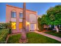 Brick building exterior with a lush lawn and walkway at 7662 E Minnezona Ave, Scottsdale, AZ 85251