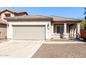 Charming single-story home with a two car garage and desert landscaping at 26058 W Yukon Dr, Buckeye, AZ 85396