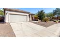 Charming single-story home with a two car garage and desert landscaping at 26058 W Yukon Dr, Buckeye, AZ 85396