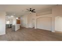 Open floor plan living area showcasing kitchen and entryway at 3011 E Colonial Pl, Chandler, AZ 85249
