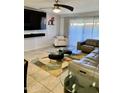 Bright living room featuring comfortable seating and a large TV at 272 Leisure World --, Mesa, AZ 85206