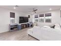 Spacious living room with comfortable seating and large TV at 3714 S 58 Dr, Phoenix, AZ 85043