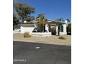 Inviting single-story home featuring a two-car garage, desert landscaping, and a freshly painted exterior at 402 W Grandview Rd, Phoenix, AZ 85023