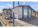 Single-story home with covered entry, desert landscaping and easy street access at 11275 N 99Th Ave # 145, Peoria, AZ 85345