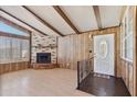 Inviting living room featuring fireplace, wood paneling and lots of natural light at 11275 N 99Th Ave # 145, Peoria, AZ 85345