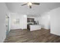 Spacious living room with recessed lighting, ceiling fan, and open concept kitchen at 24592 W St Anne Ave, Buckeye, AZ 85326