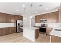 Bright kitchen features an island, stainless steel appliances, recessed lighting, and plenty of counter space at 18525 E Dario Rd, Gold Canyon, AZ 85118
