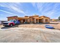 A home in progress with a truck parked outside; a new build with a blue sky background and some building materials at 3329 W Desert Dawn Dr, Phoenix, AZ 85083