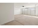 Spacious two-car garage with an automatic door opener and ample room for storage at 37014 W La Paz St, Maricopa, AZ 85138