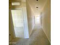 Bright hallway with smooth walls and high ceilings, showcasing modern construction at 46963 W Coe St, Maricopa, AZ 85139