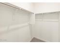 Walk-in closet with ample shelving and space for storage at 4994 W Hunter Trl, San Tan Valley, AZ 85144