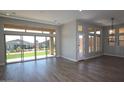 Bright living room featuring large sliding glass doors that provide seamless access to the backyard at 32513 N 135Th Dr, Peoria, AZ 85383