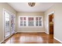 Bright dining room with hardwood floors, natural lighting, and access to outdoor space; versatile for entertaining at 1346 W Willetta St, Phoenix, AZ 85007