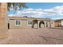 Single story home with a landscaped front yard at 6010 W Lewis Ave, Phoenix, AZ 85035