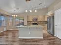Kitchen boasts granite countertops and stainless steel appliances at 916 E Beautiful Ln, Phoenix, AZ 85042