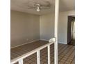 Inviting living room featuring tile flooring and a ceiling fan at 4147 W Reade Ave, Phoenix, AZ 85019