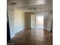 Bright living area featuring tile flooring and sliding glass door at 4147 W Reade Ave, Phoenix, AZ 85019