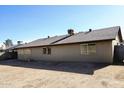 Tan house exterior with large backyard and mature trees at 4216 W Lupine Ave, Phoenix, AZ 85029