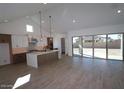 Open-concept living space with a kitchen, dining and living area at 21601 W Mariposa St, Buckeye, AZ 85396