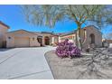 Lovely single-Gathering home with a two-car garage, desert landscaping, and a paved driveway at 32030 N 20Th Ln, Phoenix, AZ 85085