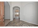 Welcoming foyer showcasing tile flooring and a view into the living area at 32030 N 20Th Ln, Phoenix, AZ 85085