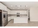 Contemporary kitchen with an island, stainless steel appliances, and ample cabinet space at 18792 E Panchito Dr, Gold Canyon, AZ 85118