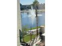 Scenic lake view with fountain, palm tree and patio furniture at 2511 W Queen Creek Rd # 205, Chandler, AZ 85248