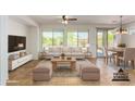 Bright living room with large windows, neutral furniture, and tile flooring at 4548 E Carob Dr, Gilbert, AZ 85298