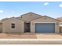 Charming single-story home featuring a blue garage door, a modern gray exterior and low-maintenance desert landscaping at 4937 W Hunter Trl, San Tan Valley, AZ 85144