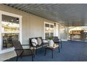 Inviting covered porch with cozy seating area and stylish decor at 2233 E Behrend Dr # 132, Phoenix, AZ 85024