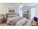 Serene bedroom retreat with a comfortable bed, soft lighting, and elegant decor, creating a relaxing atmosphere at 9902 W Sandstone Dr, Sun City, AZ 85351