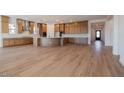 Spacious kitchen with stainless steel appliances, a large center island, and wood-look flooring at 1296 E Coconino Way, Gilbert, AZ 85298