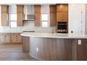 Beautiful kitchen with a center island, stainless steel appliances, and elegant backsplash at 1296 E Coconino Way, Gilbert, AZ 85298